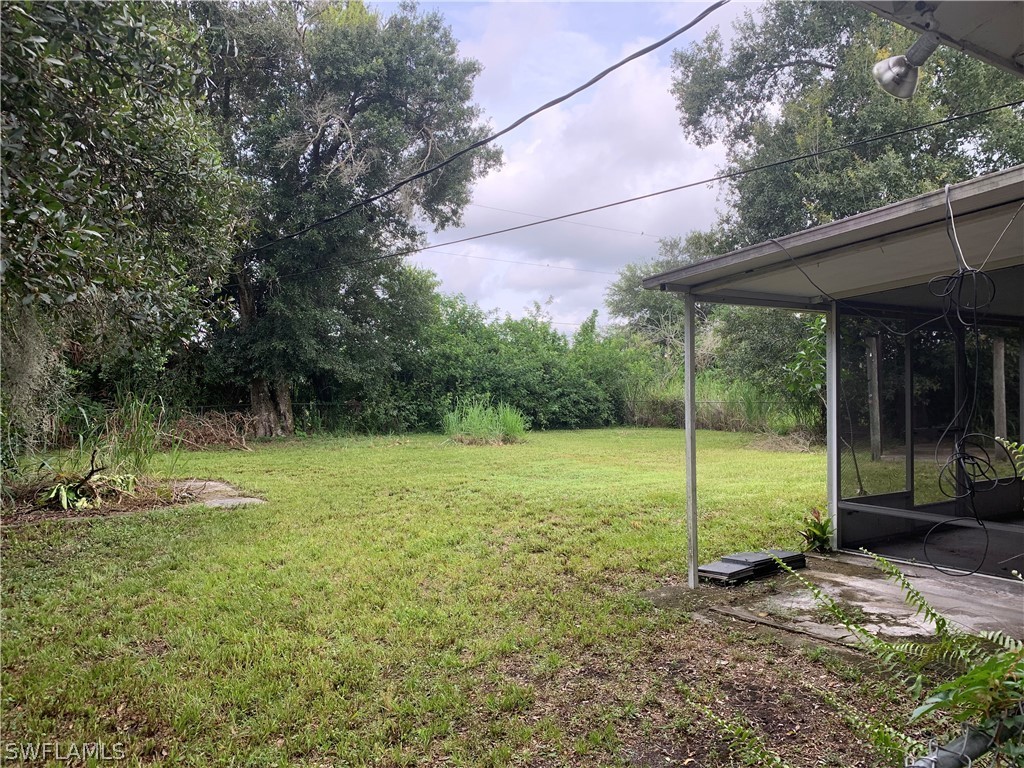 2819 W Road Fort Myers, FL 33905 - Photo 12 of 12 a view of a backyard with plants and garden