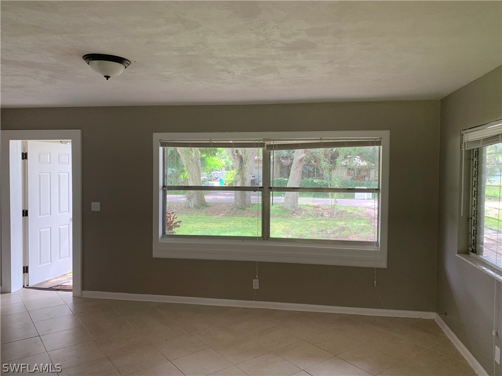 2819 W Road Fort Myers, FL 33905 - Photo 3 of 12 a view of an empty room with a window