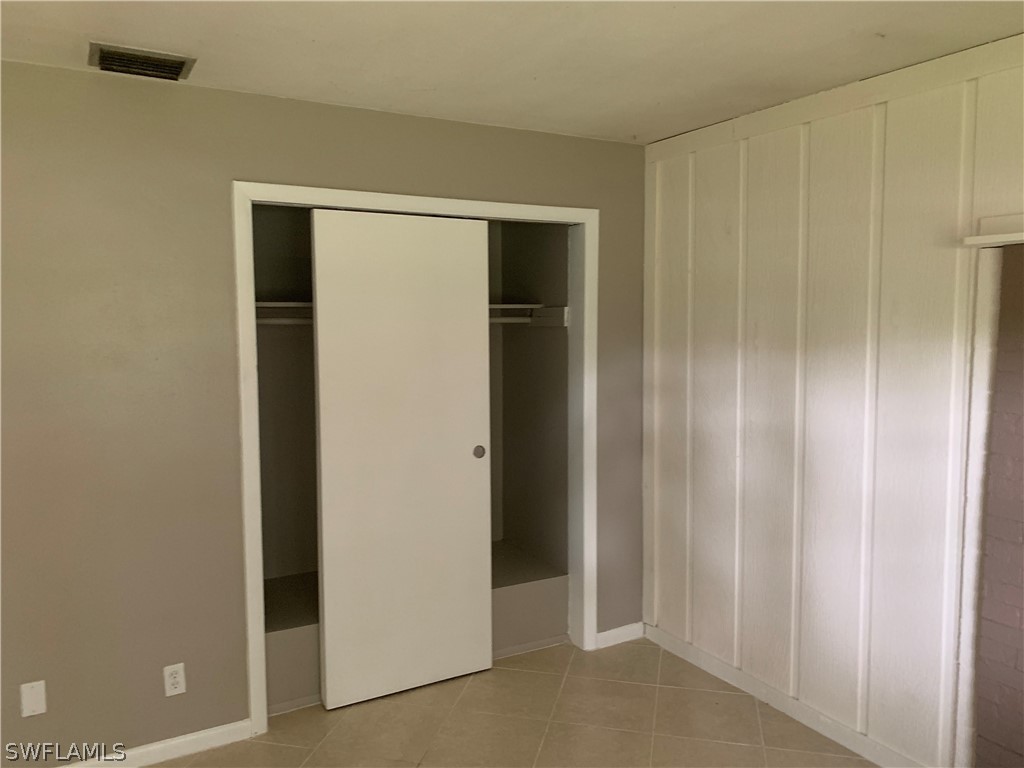 2819 W Road Fort Myers, FL 33905 - Photo 10 of 12 a view of an empty room with wooden floor