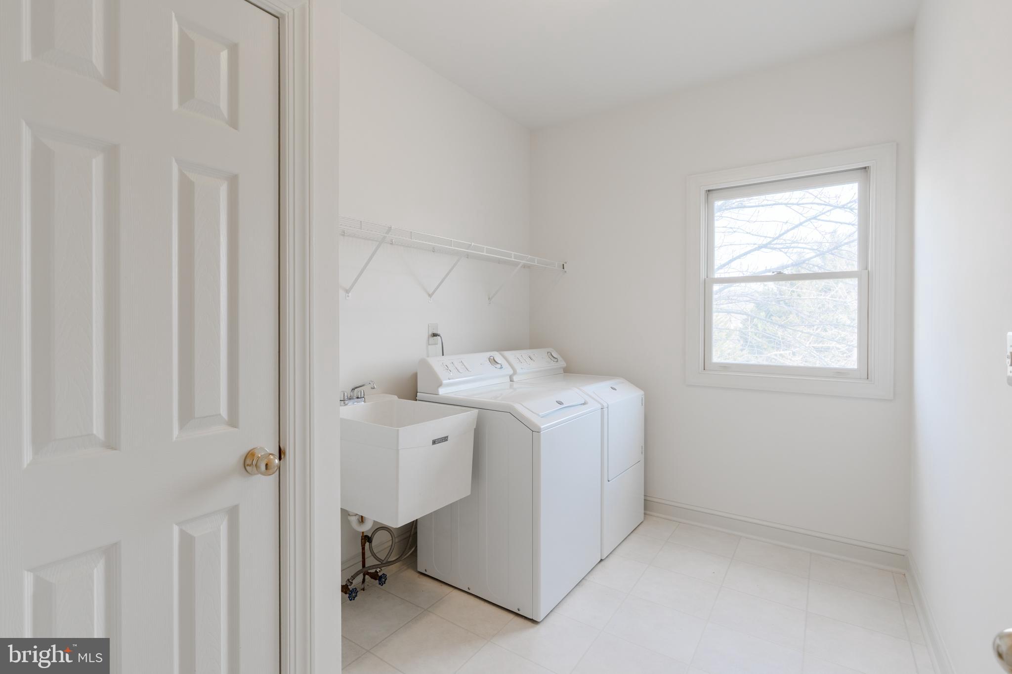 9 Corbin Drive Exton, PA 19341 - Photo 14 of 30 a utility room with dryer and washer