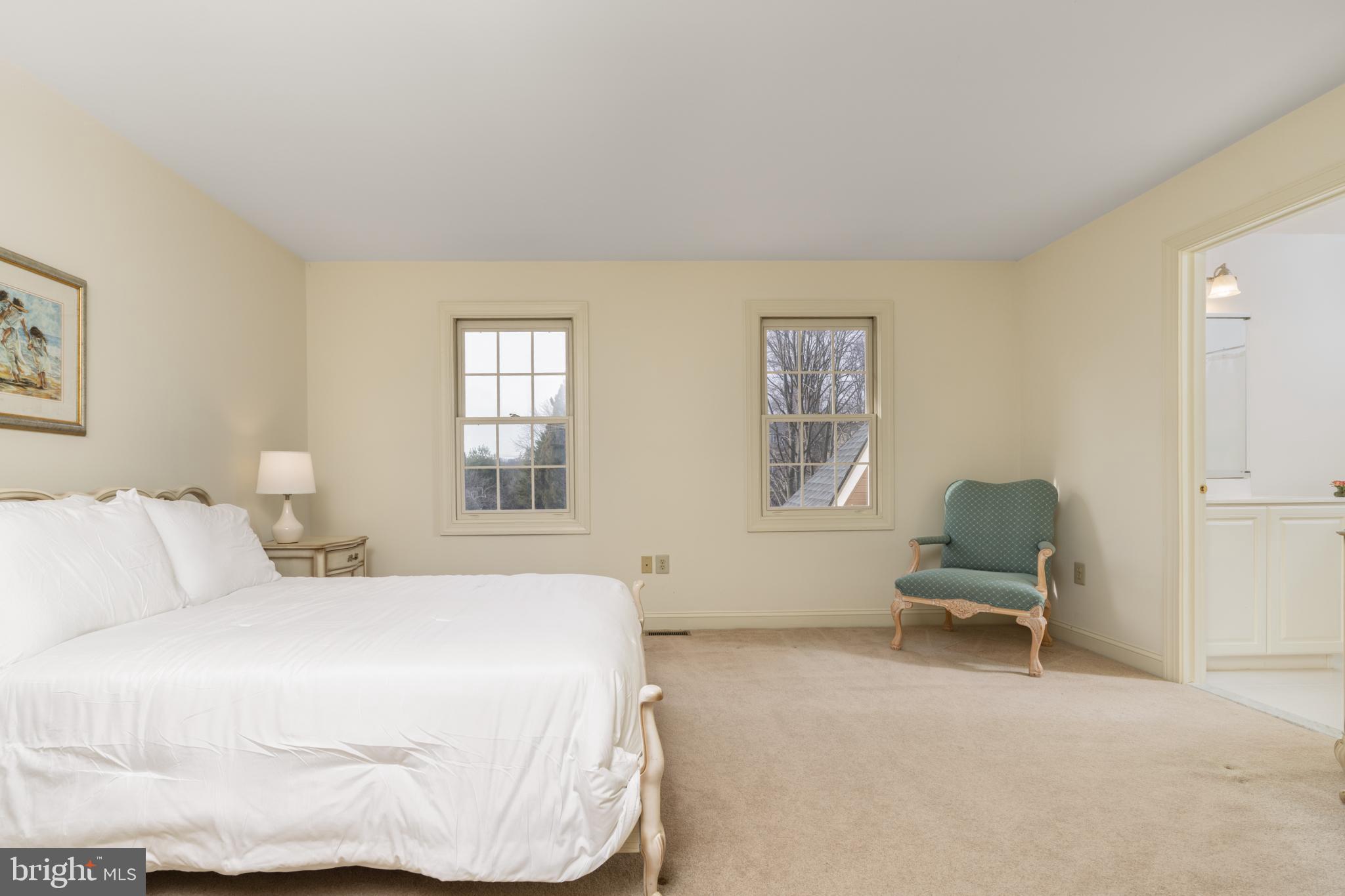 9 Corbin Drive Exton, PA 19341 - Photo 20 of 30 a bedroom with a bed chair and window