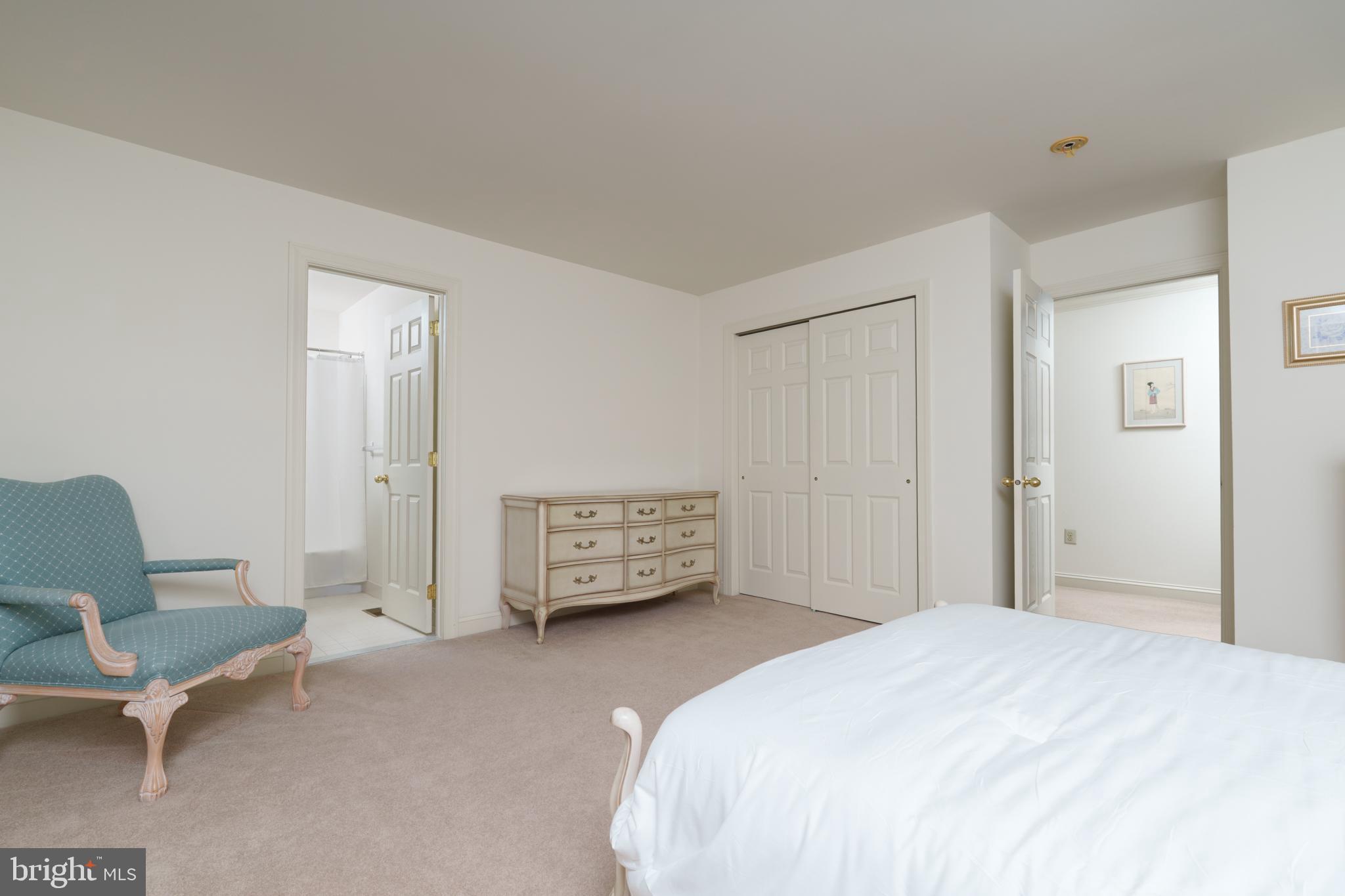 9 Corbin Drive Exton, PA 19341 - Photo 21 of 30 a bedroom with a bed a chair and dresser