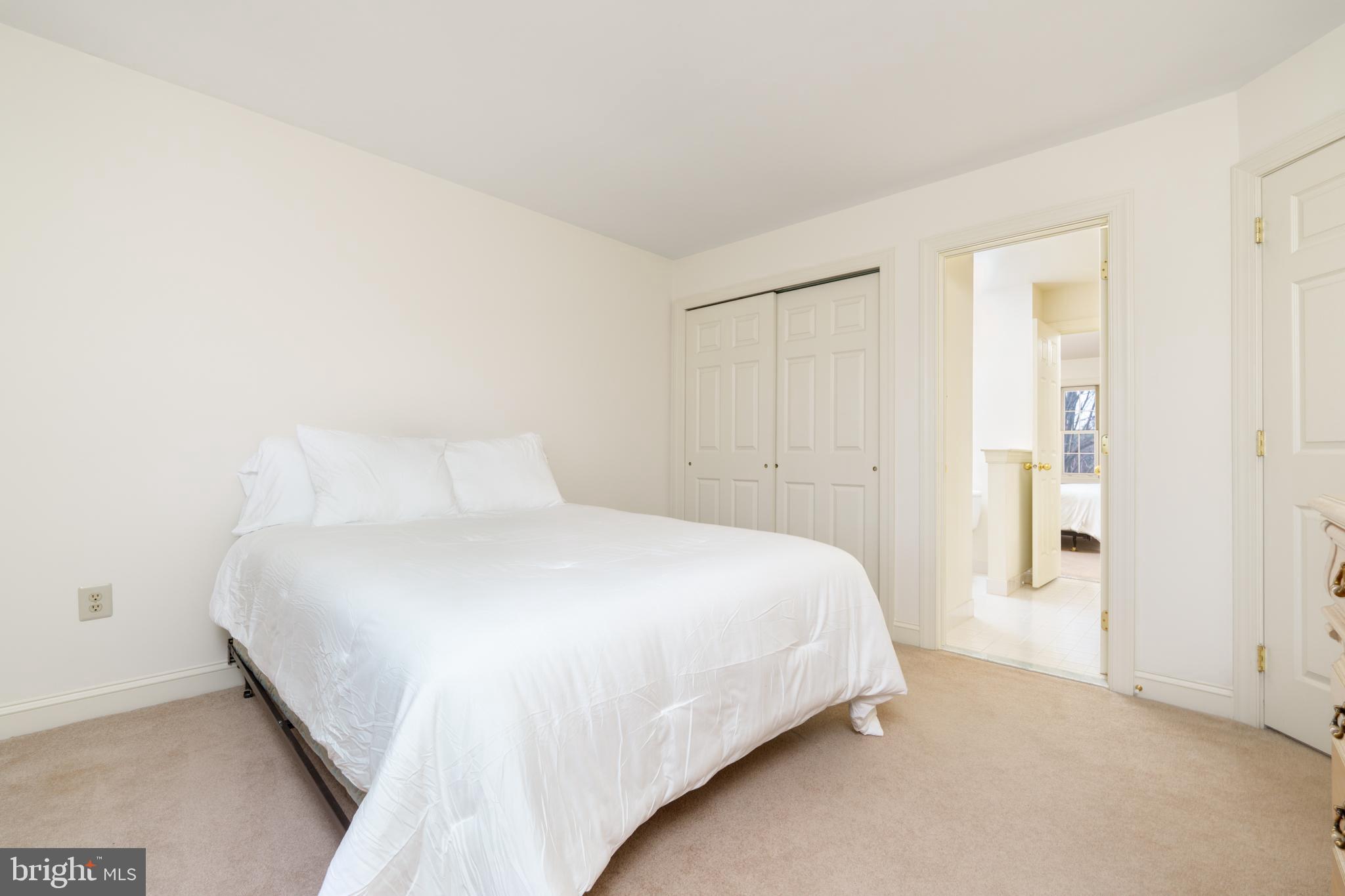 9 Corbin Drive Exton, PA 19341 - Photo 23 of 30 a large bed sitting in a bedroom and closet