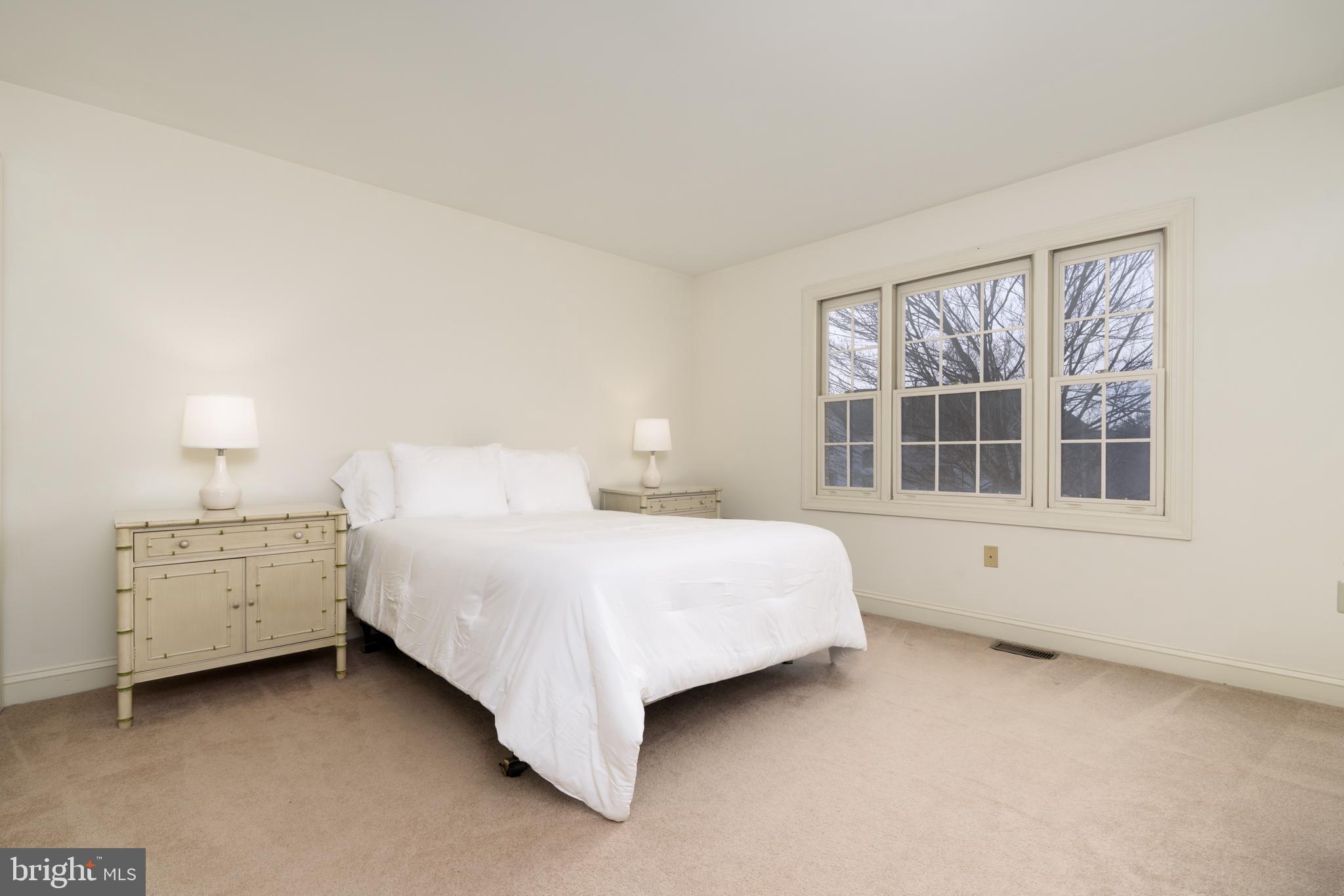 9 Corbin Drive Exton, PA 19341 - Photo 25 of 30 a spacious bedroom with a bed and window