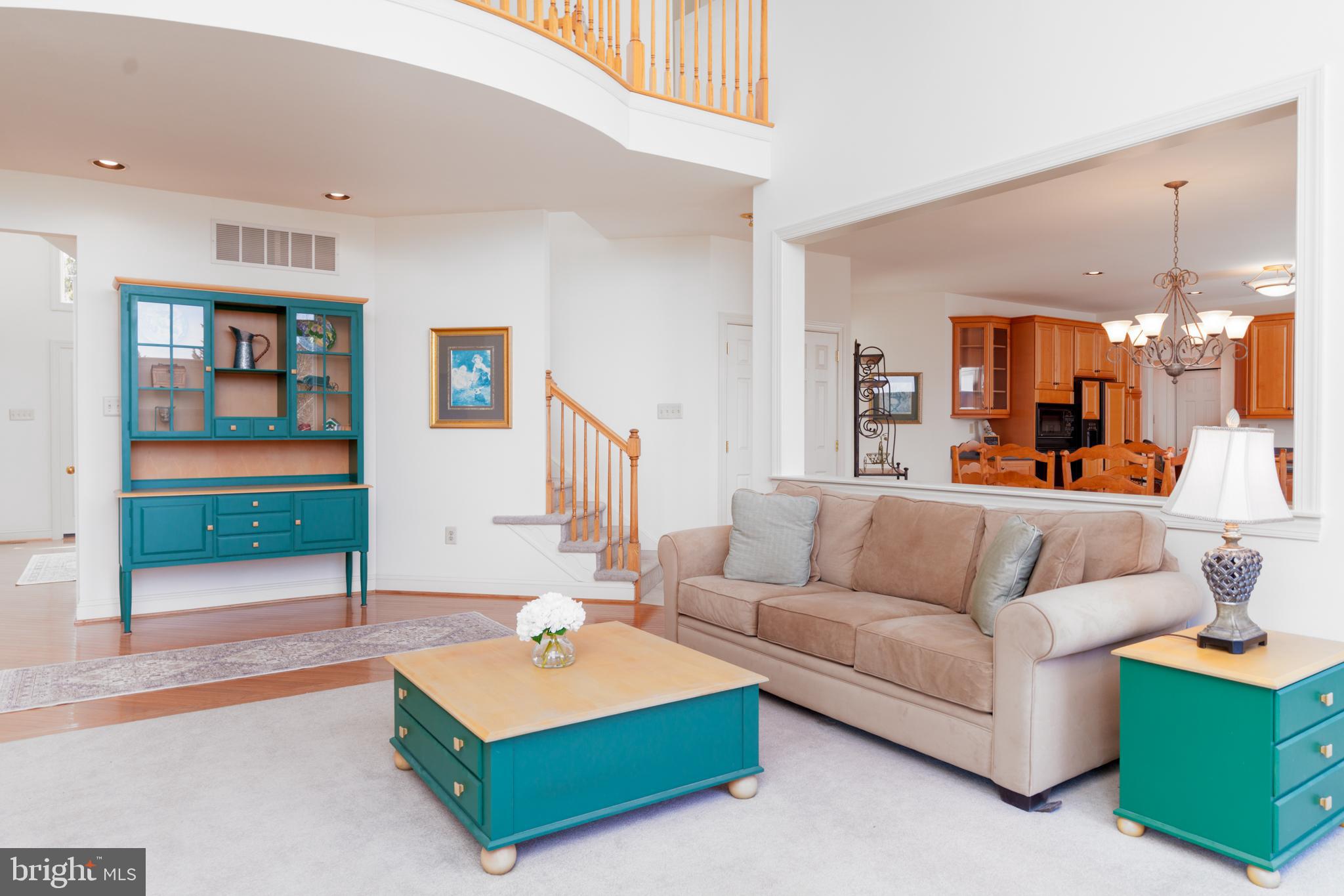 9 Corbin Drive Exton, PA 19341 - Photo 10 of 30 a living room with furniture and a large mirror