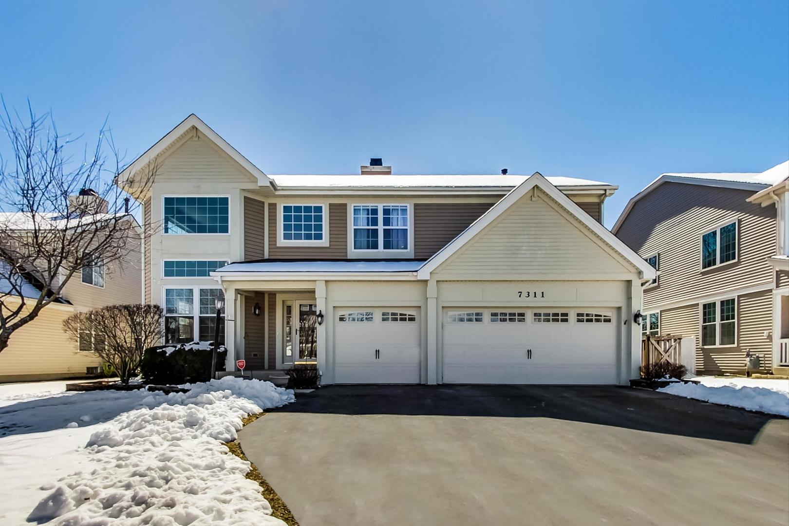 front view of a house with a yard