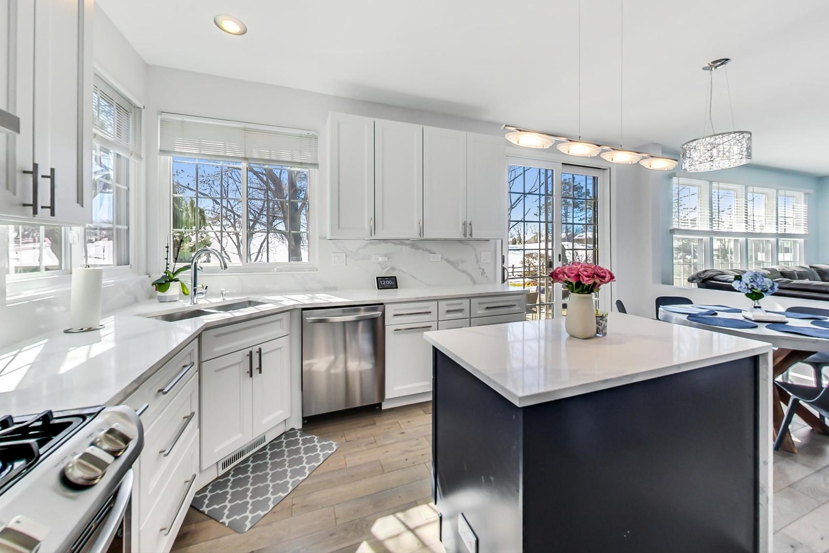 7311 Dada Drive Gurnee, IL 60031 - Photo 11 of 51 a kitchen with a sink stove and cabinets