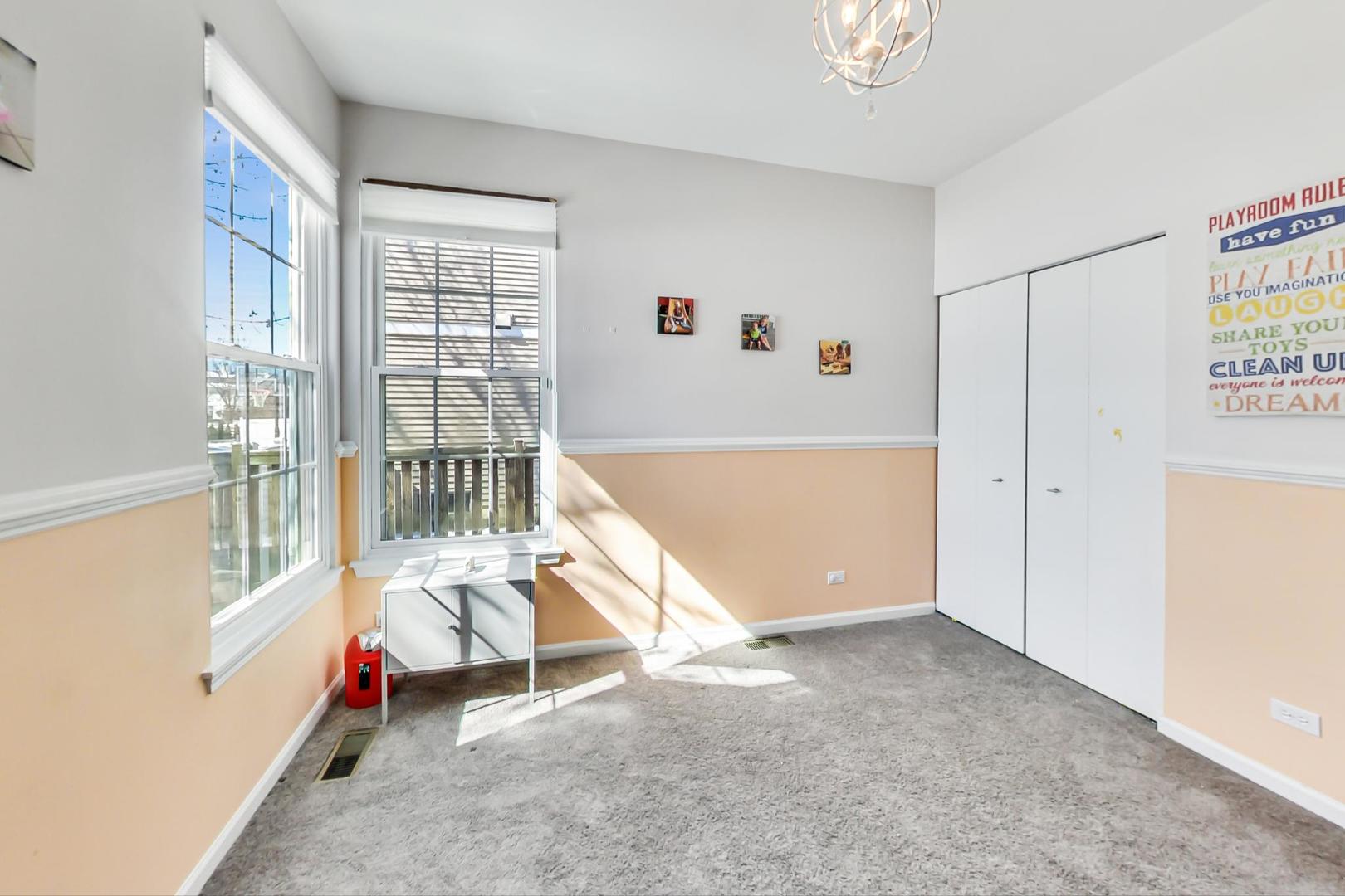 7311 Dada Drive Gurnee, IL 60031 - Photo 17 of 51 an entryway with wooden floor and windows