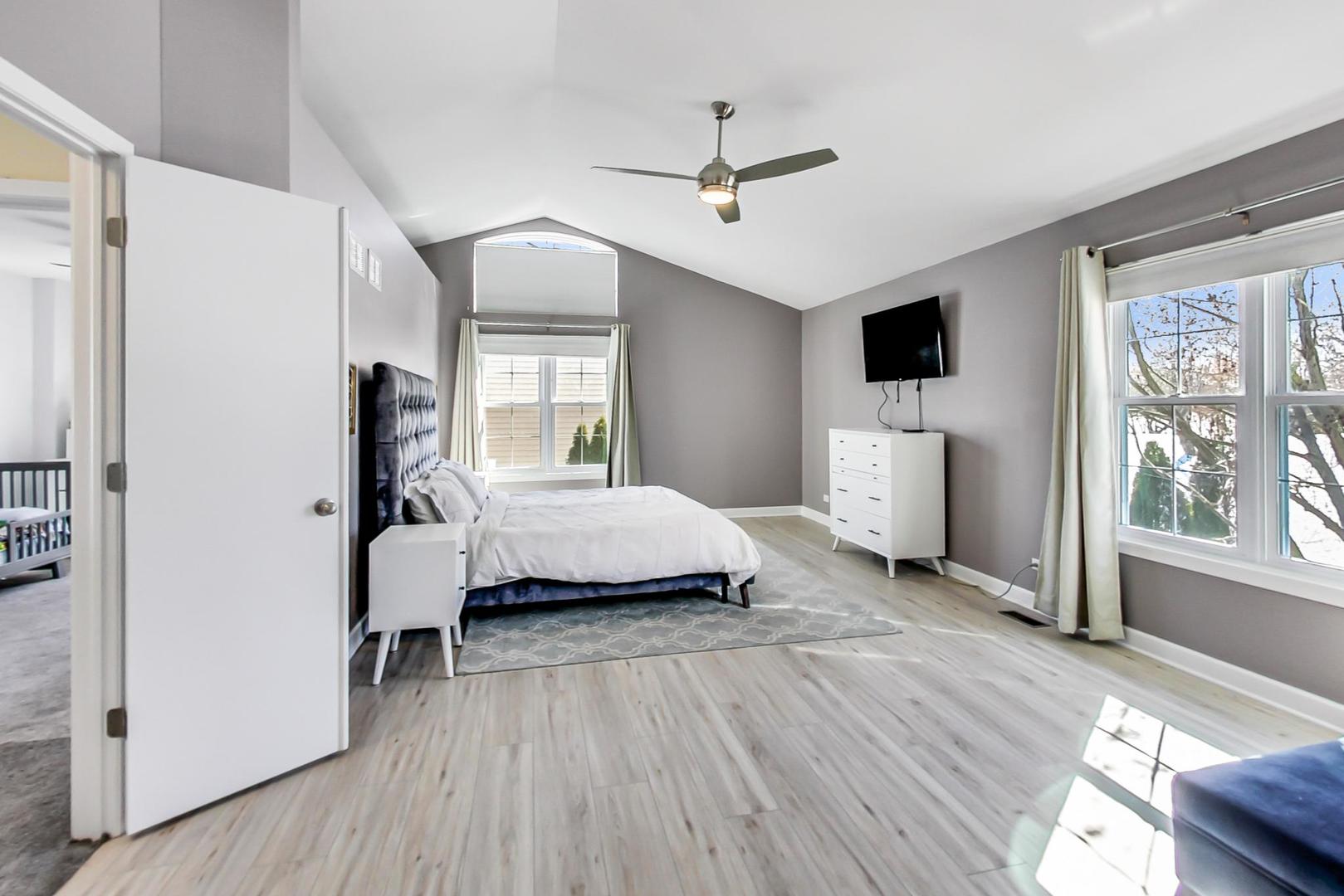 7311 Dada Drive Gurnee, IL 60031 - Photo 23 of 51 a spacious bedroom with a bed and a large window