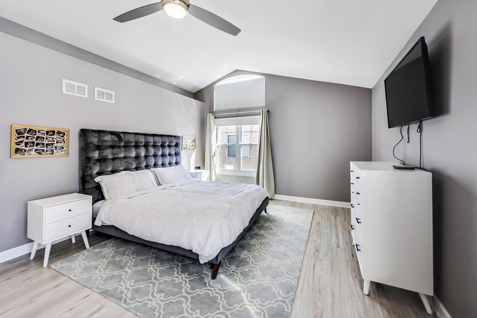 7311 Dada Drive Gurnee, IL 60031 - Photo 24 of 51 a bedroom with a bed and a flat screen tv