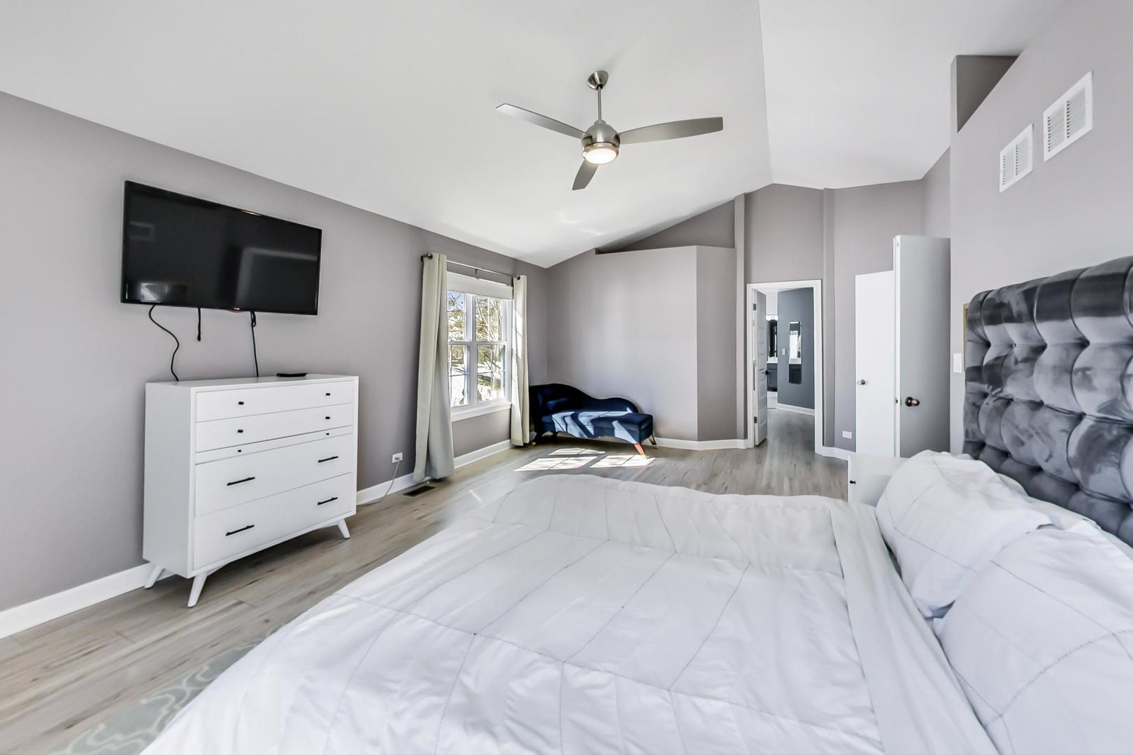 7311 Dada Drive Gurnee, IL 60031 - Photo 25 of 51 a bedroom with furniture and flat screen tv