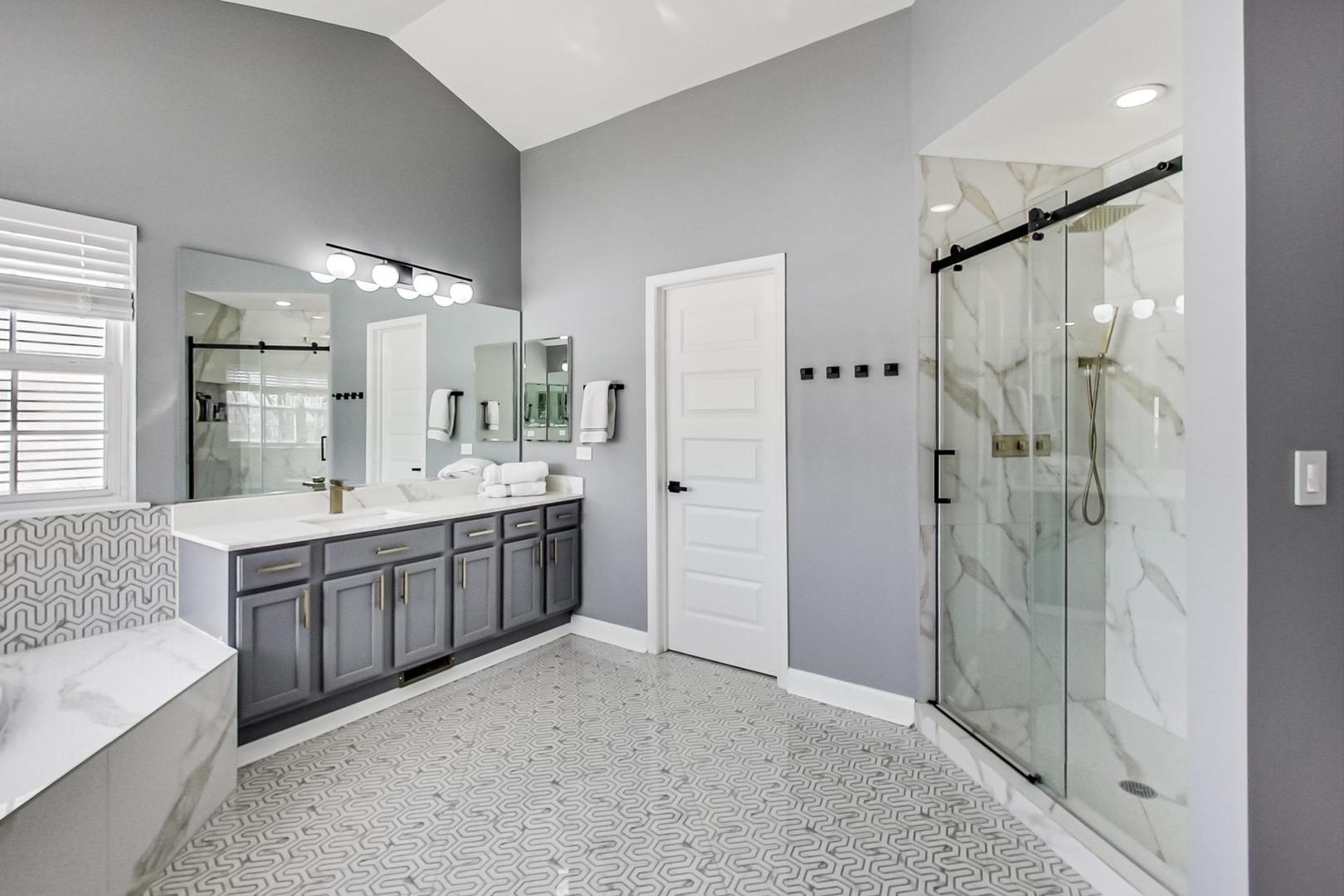 7311 Dada Drive Gurnee, IL 60031 - Photo 29 of 51 a bathroom with a double vanity sink toilet mirror bathtub and window