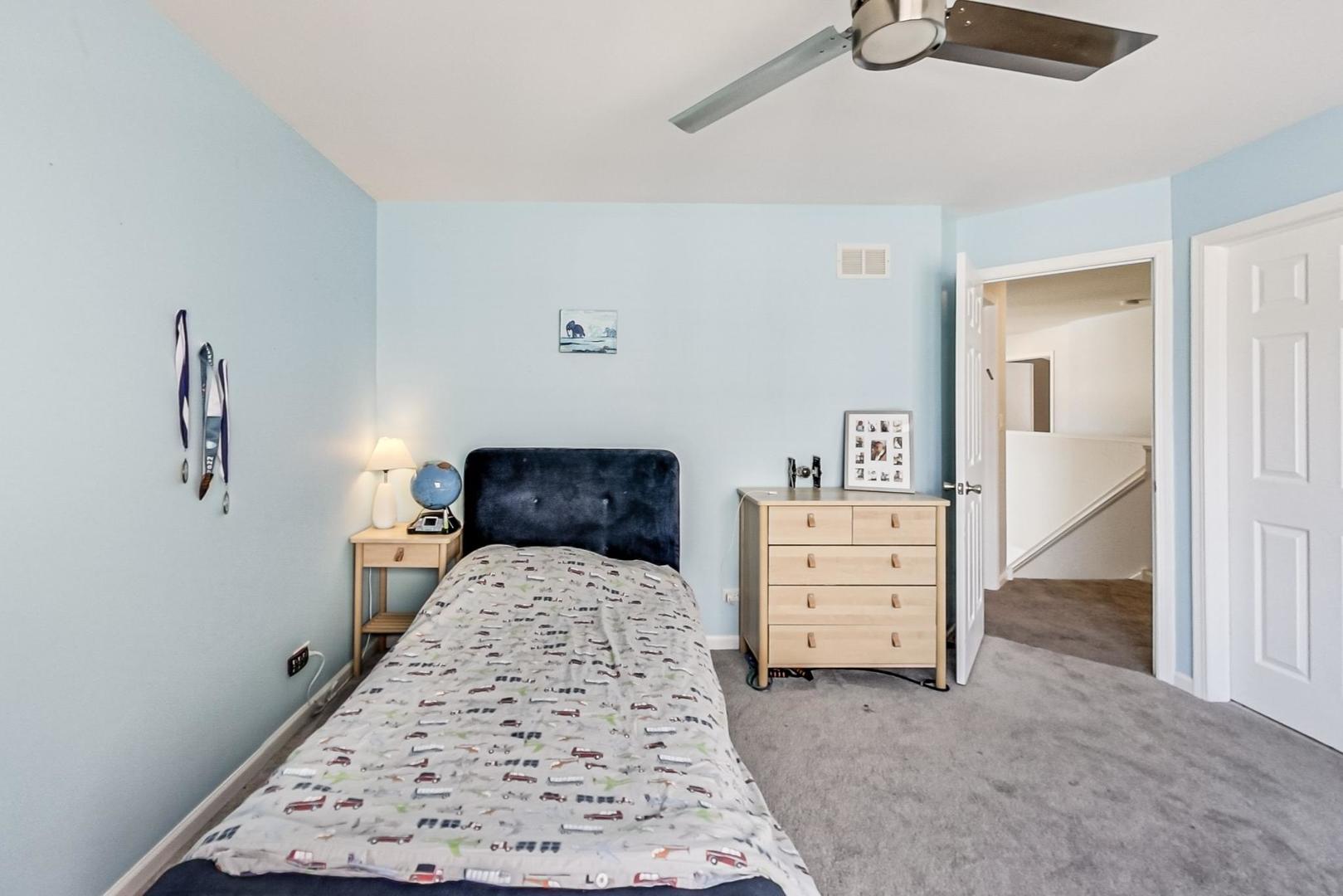 7311 Dada Drive Gurnee, IL 60031 - Photo 36 of 51 a bed room with a bed and a dresser