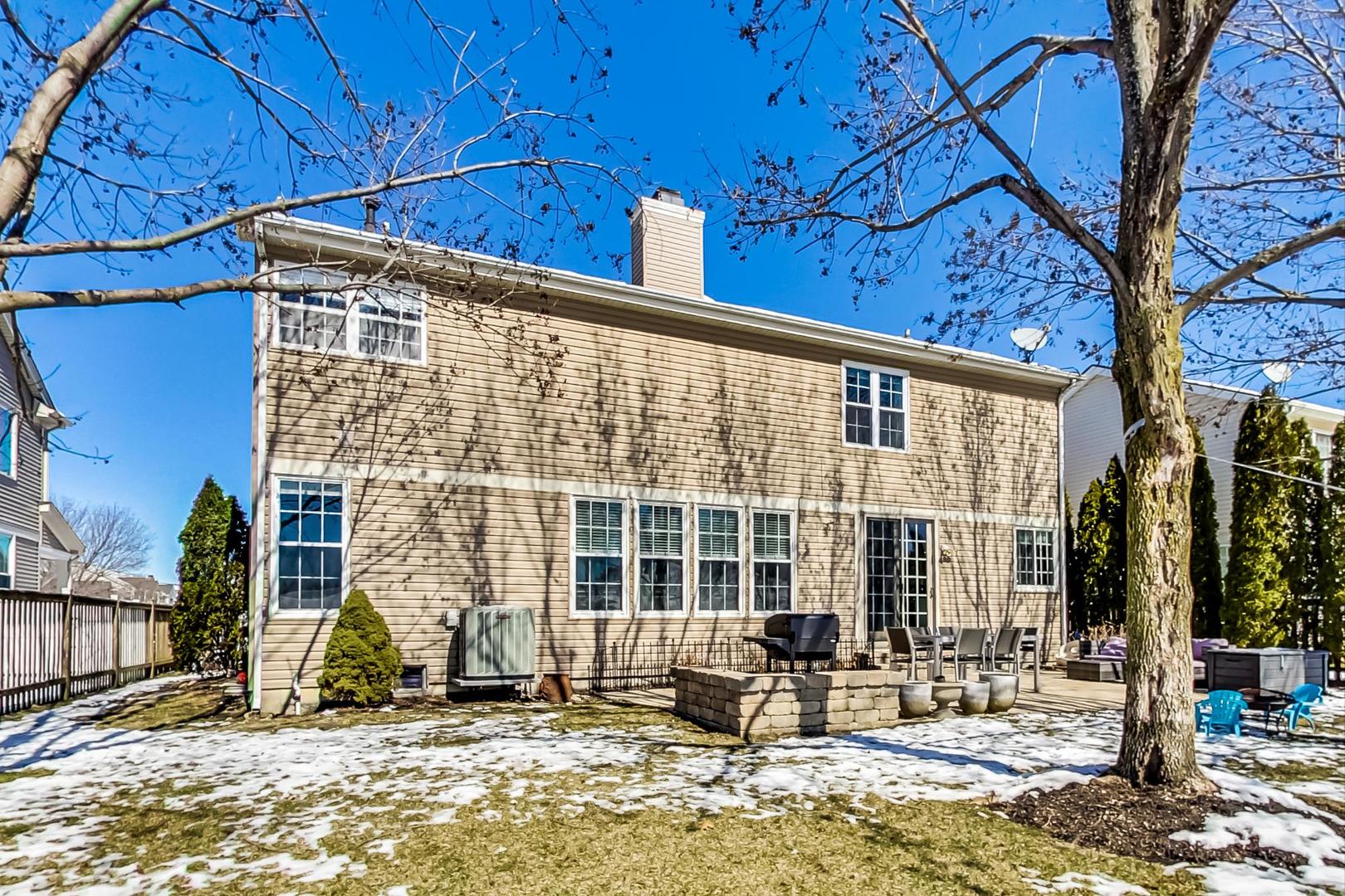 7311 Dada Drive Gurnee, IL 60031 - Photo 47 of 51 a front view of a building with a garden