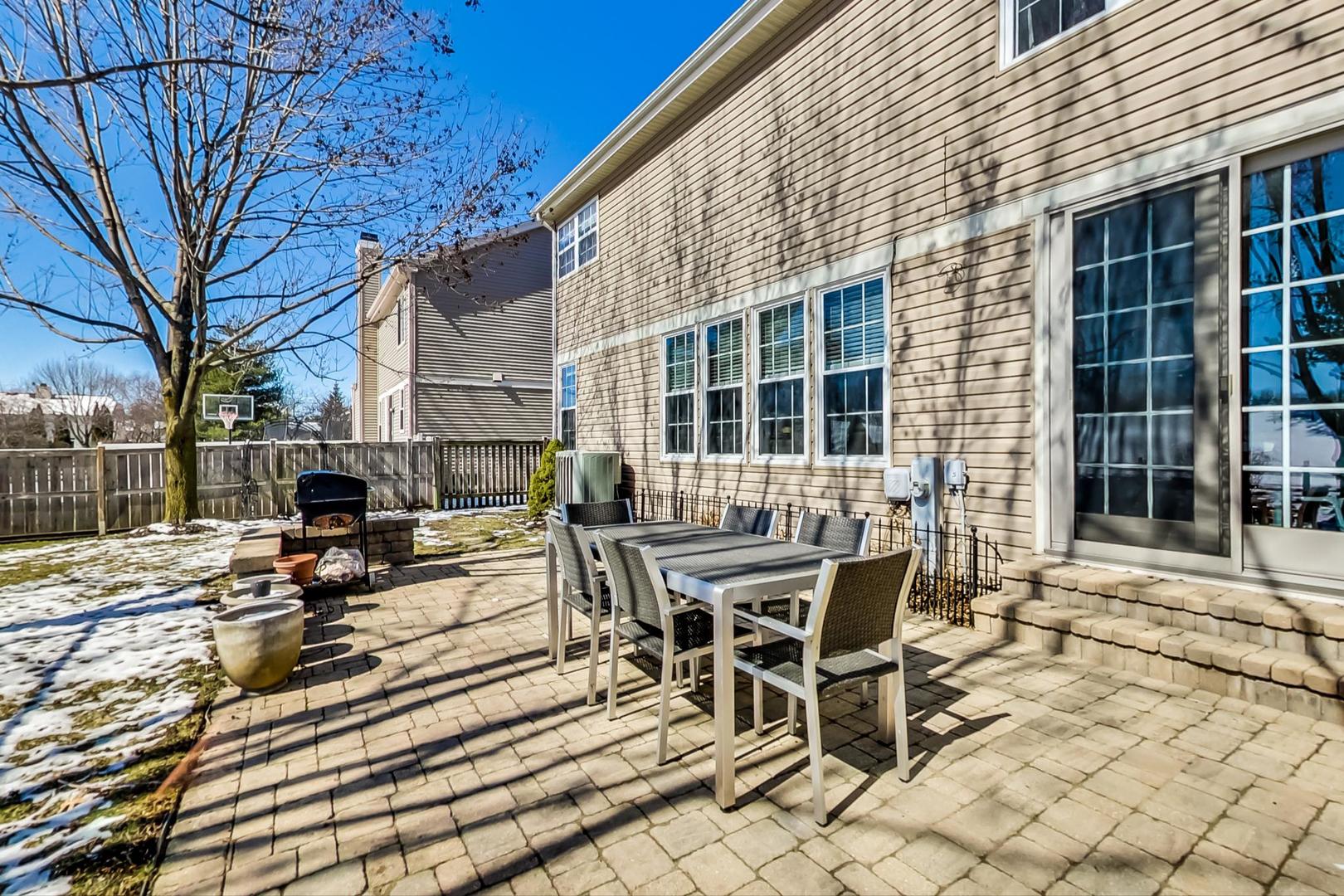 7311 Dada Drive Gurnee, IL 60031 - Photo 48 of 51 a view of a patio with table and chairs and wooden floor
