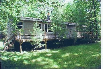 681 Pine Road Otis, MA 01029 - Photo 1 of 1 a house view with a garden space