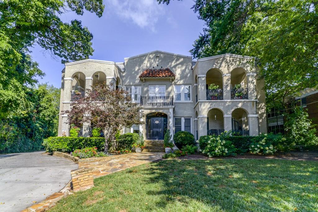 856 Briarcliff Road Northeast, Unit 24 Atlanta, GA 30306 - Photo 1 of 1 a front view of a house with a garden