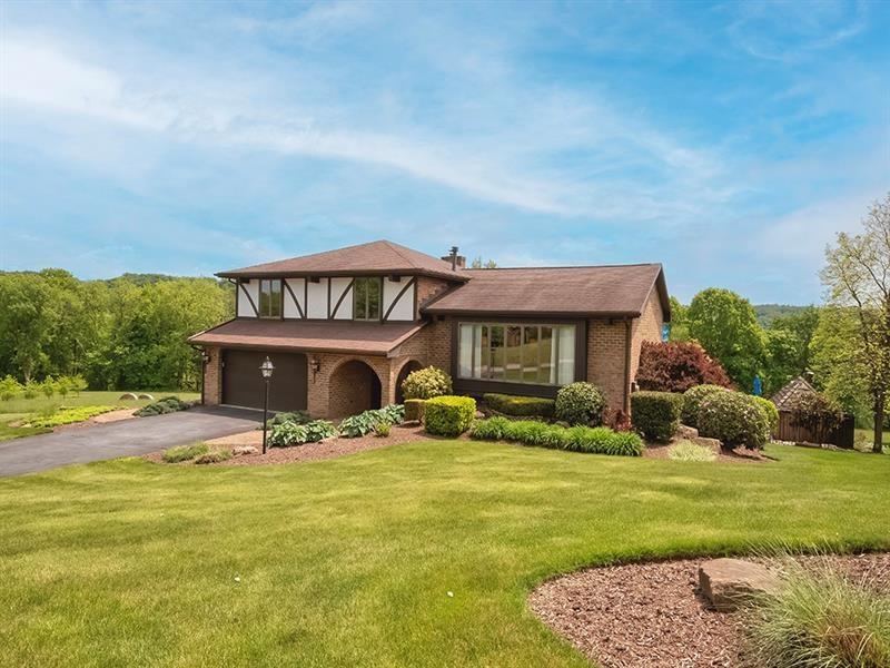 132 Ridge Drive Apollo, PA 15613 - Photo 1 of 37 a front view of a house with garden