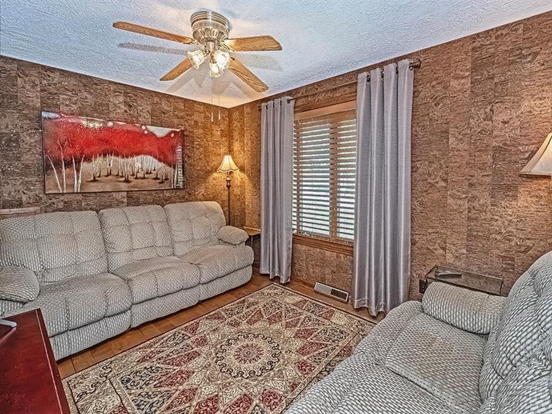 132 Ridge Drive Apollo, PA 15613 - Photo 12 of 37 a bedroom with a bed and a chandelier