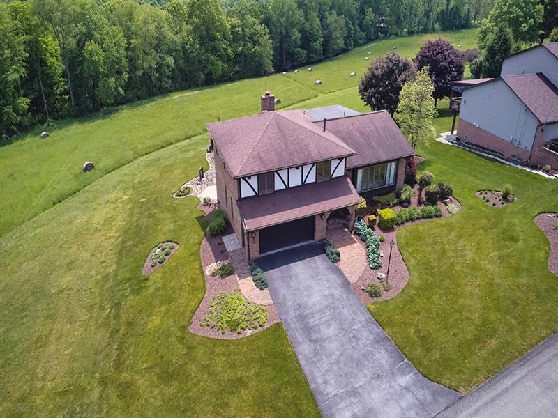 132 Ridge Drive Apollo, PA 15613 - Photo 14 of 37 an aerial view of a house with garden space and street view