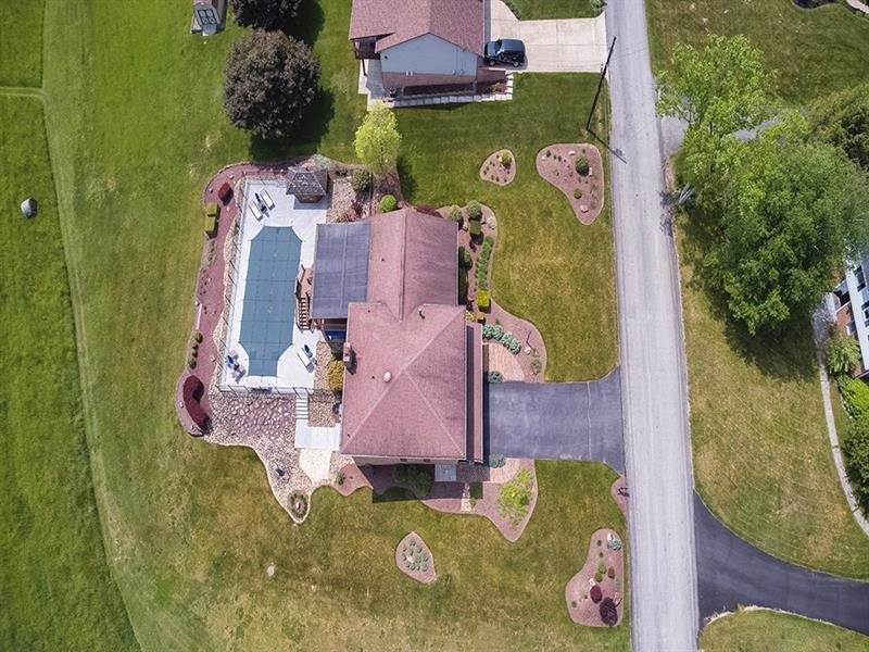 132 Ridge Drive Apollo, PA 15613 - Photo 15 of 37 an aerial view of a house with a swimming pool and outdoor seating