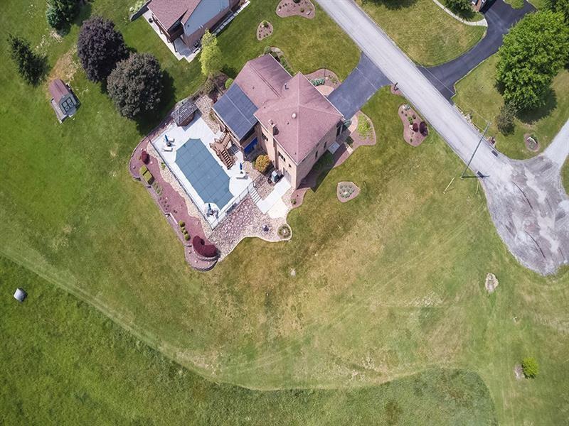132 Ridge Drive Apollo, PA 15613 - Photo 16 of 37 an aerial view of a house with a swimming pool