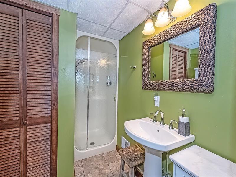 132 Ridge Drive Apollo, PA 15613 - Photo 23 of 37 a bathroom with a sink a mirror and a shower