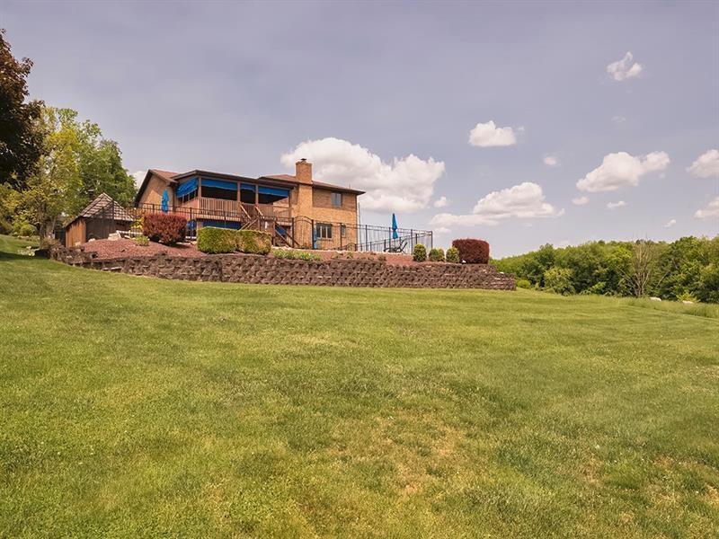132 Ridge Drive Apollo, PA 15613 - Photo 26 of 37 a front view of a house with a garden