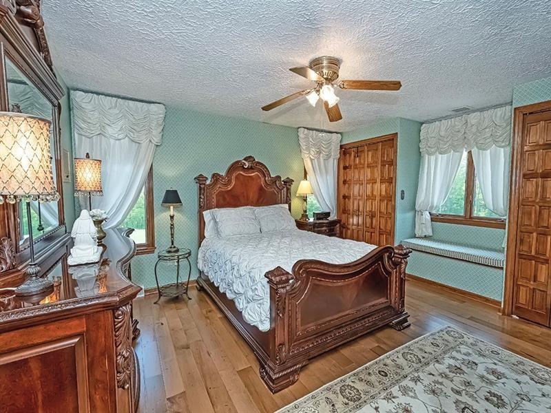 132 Ridge Drive Apollo, PA 15613 - Photo 7 of 37 a bed sitting in a room next to a window