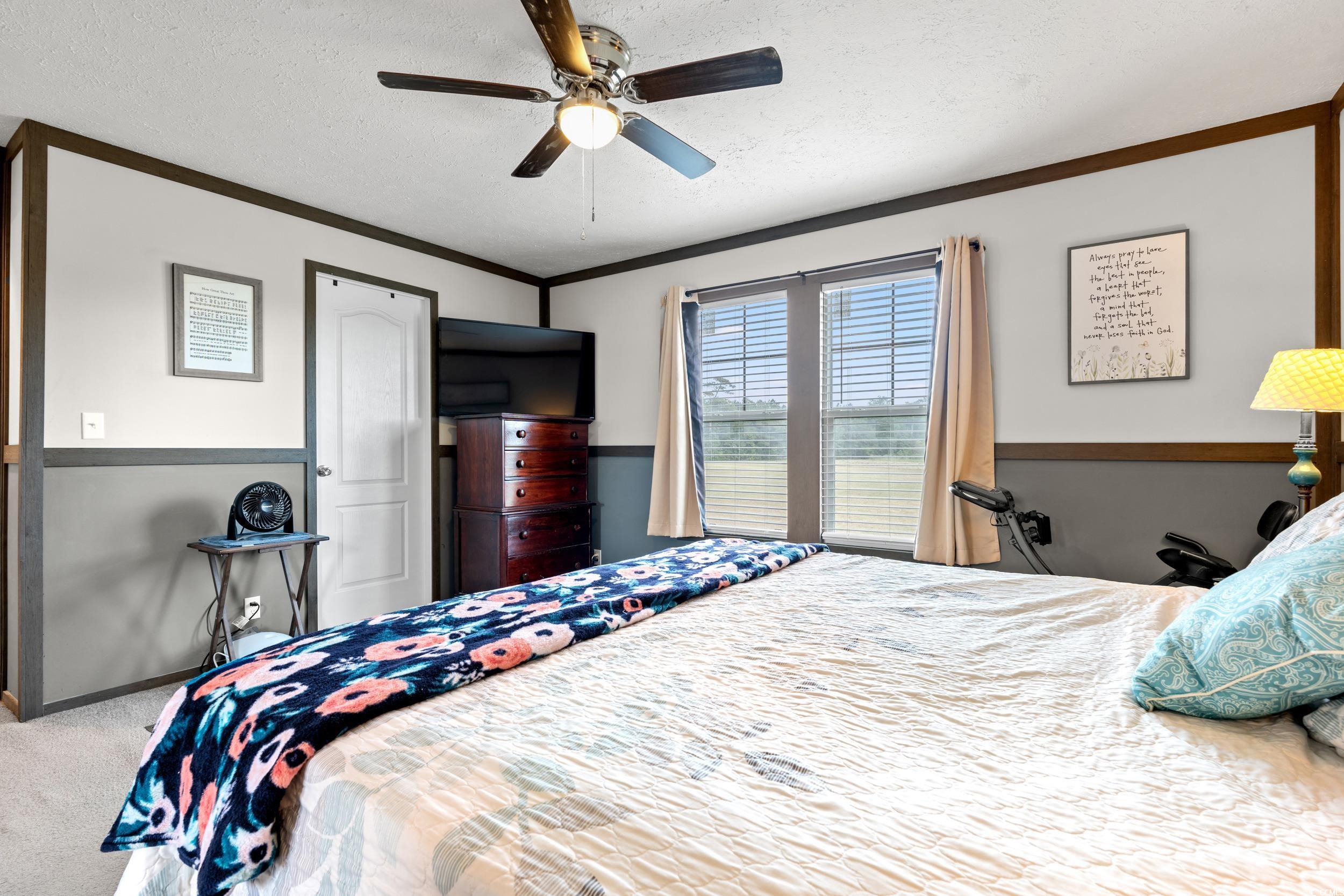 1217 Poplar Creek Road Lake View, SC 29563 - Photo 14 of 38 Bedroom with a textured ceiling, carpet floors, ceiling fan, and crown molding