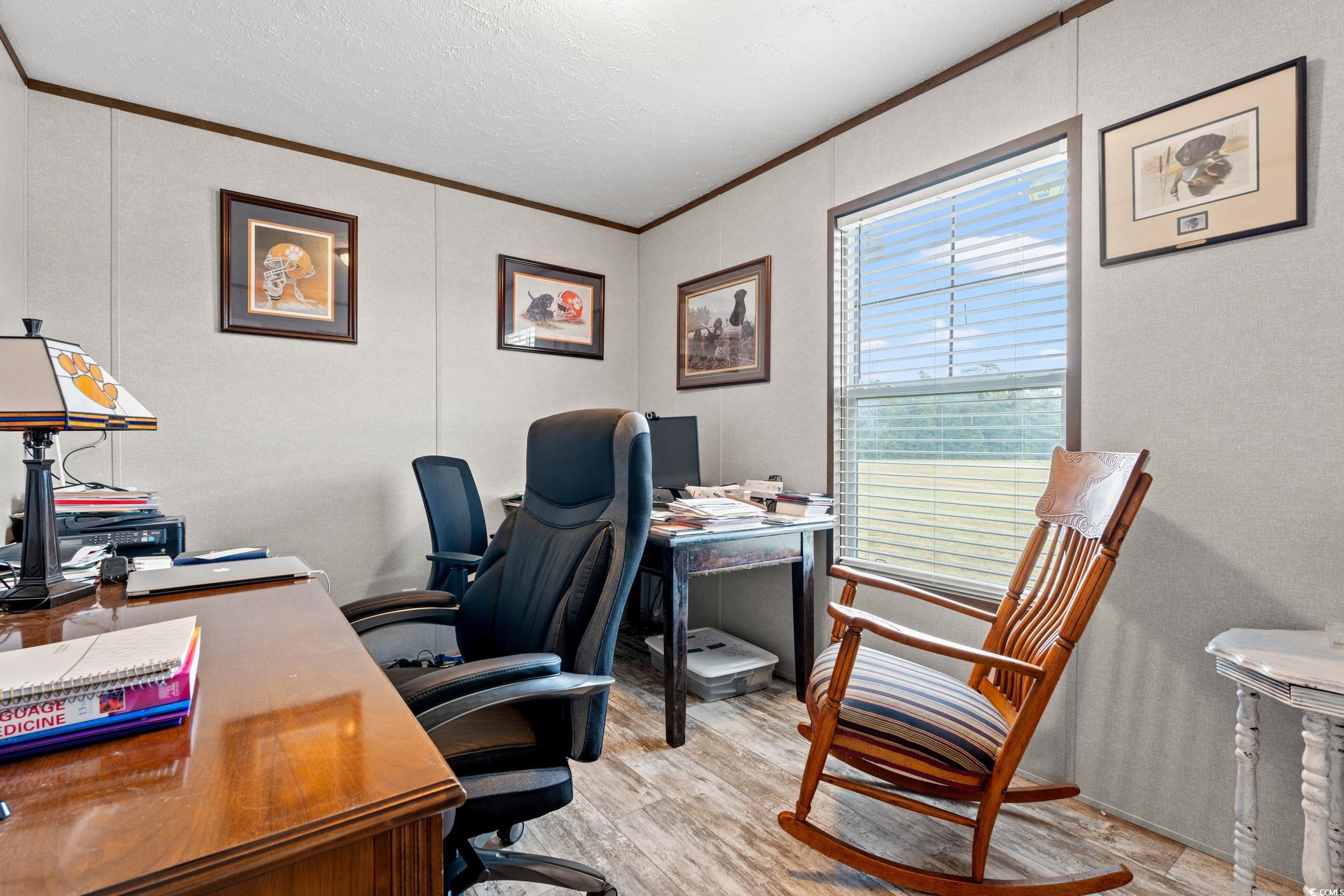 1217 Poplar Creek Road Lake View, SC 29563 - Photo 21 of 38 Office space with ornamental molding, light wood-style floors, and a textured ceiling