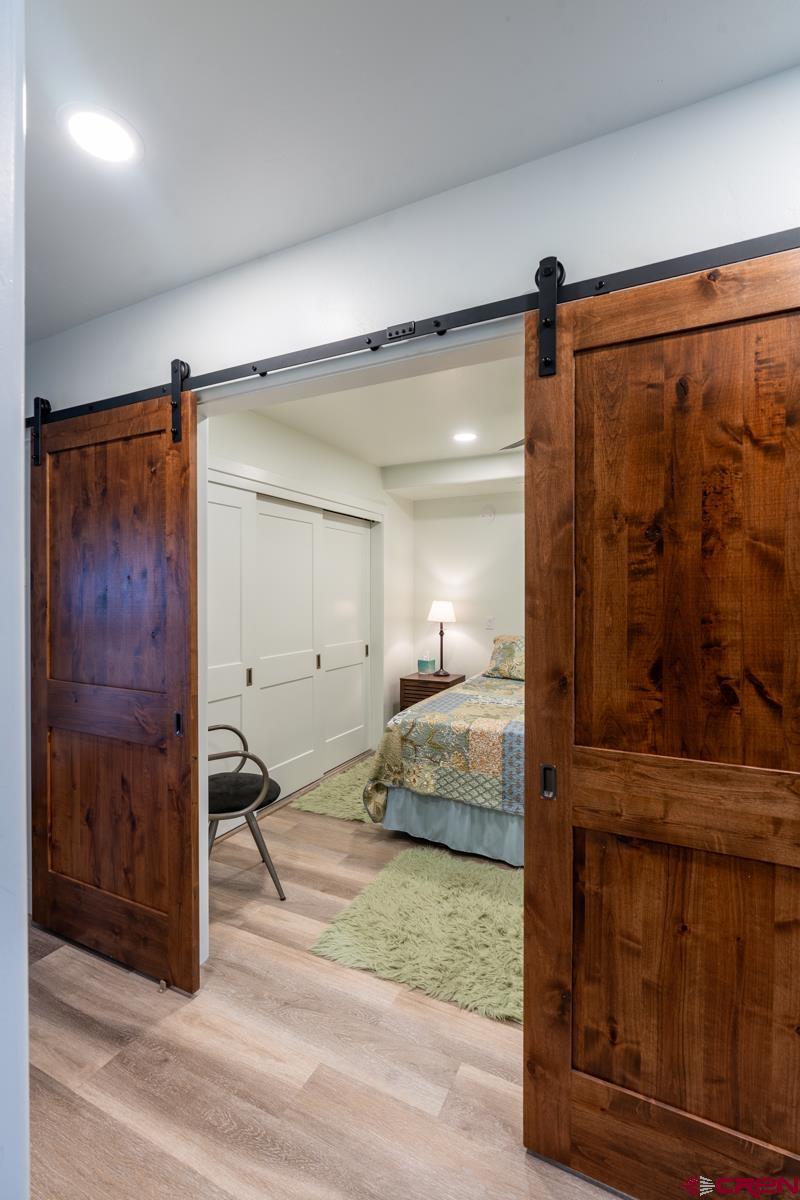 73 Tamarron Drive, Unit 866 Durango, CO 81301 - Photo 12 of 34 a bedroom with a bed and a mirror