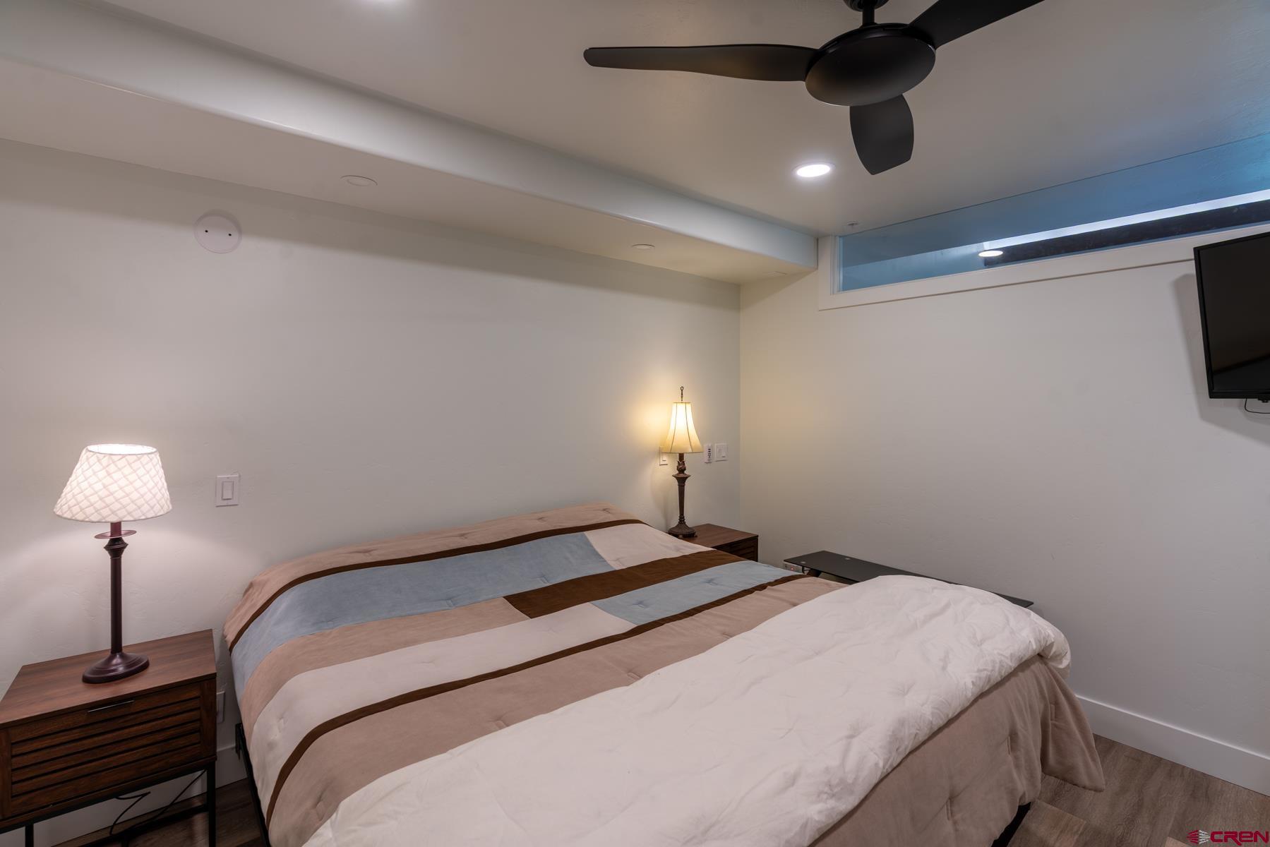 73 Tamarron Drive, Unit 866 Durango, CO 81301 - Photo 13 of 34 a bedroom with a bed and a lamp