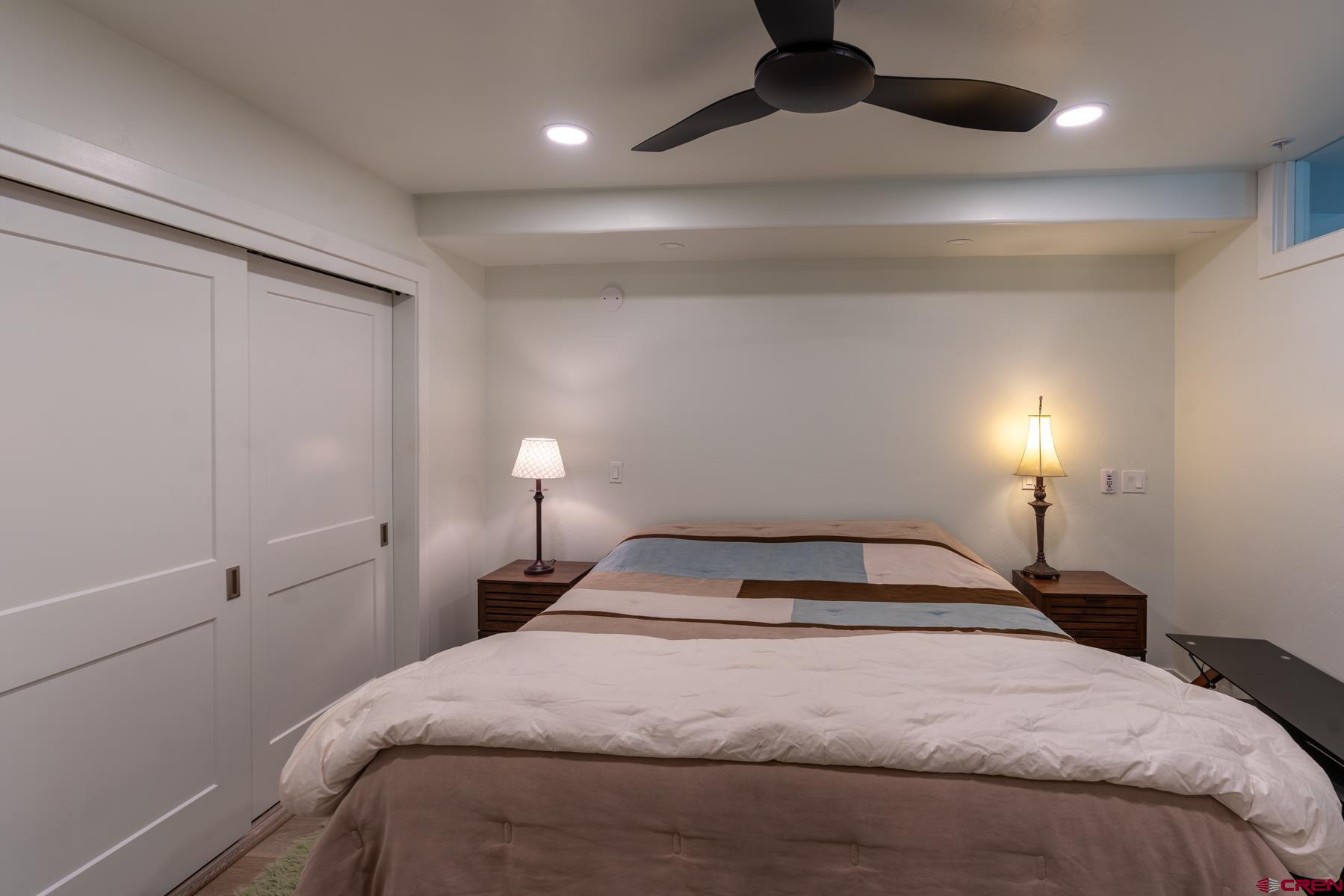 73 Tamarron Drive, Unit 866 Durango, CO 81301 - Photo 14 of 34 a bedroom with a bed and a lamp