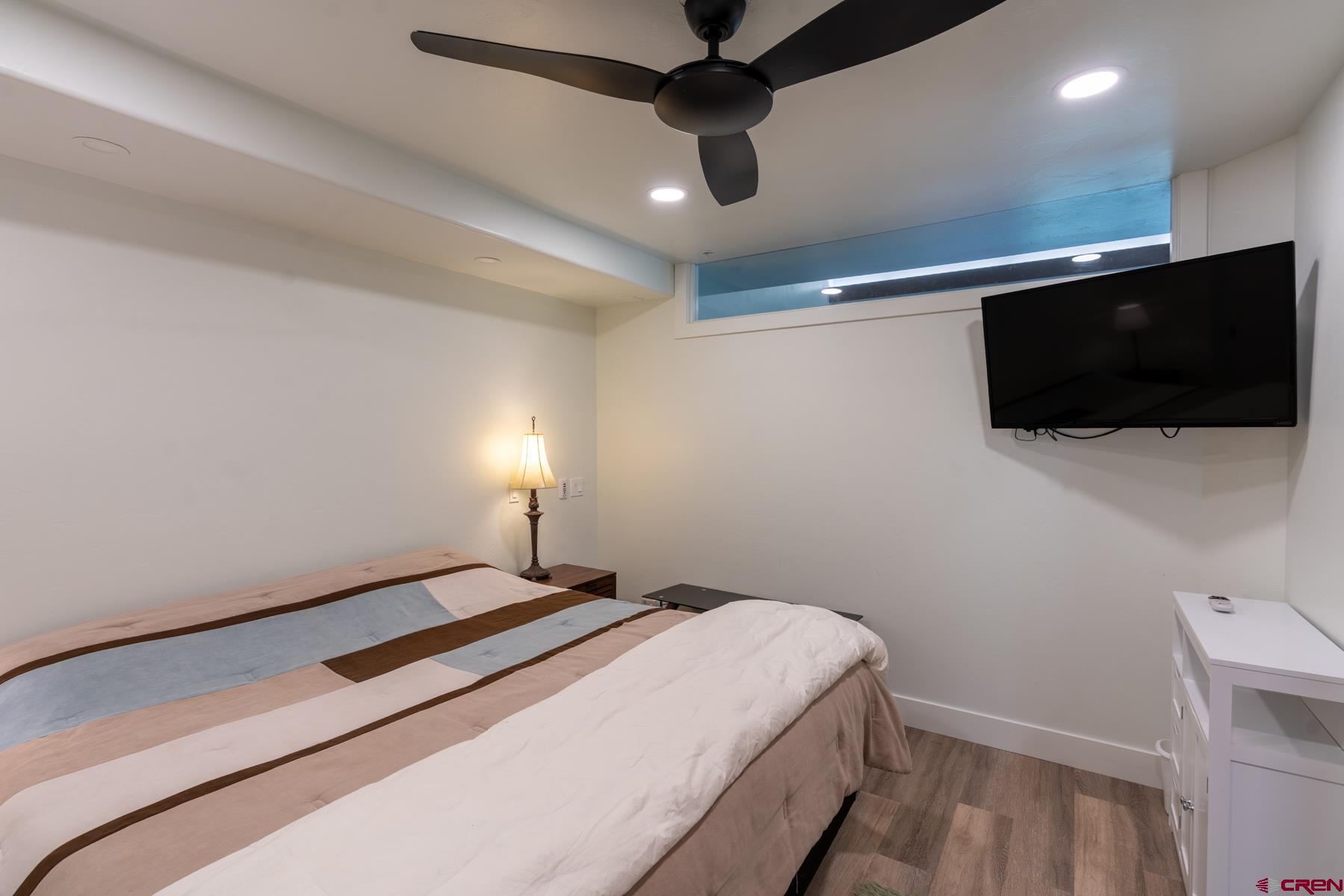 73 Tamarron Drive, Unit 866 Durango, CO 81301 - Photo 15 of 34 a bedroom with a bed and a flat screen tv