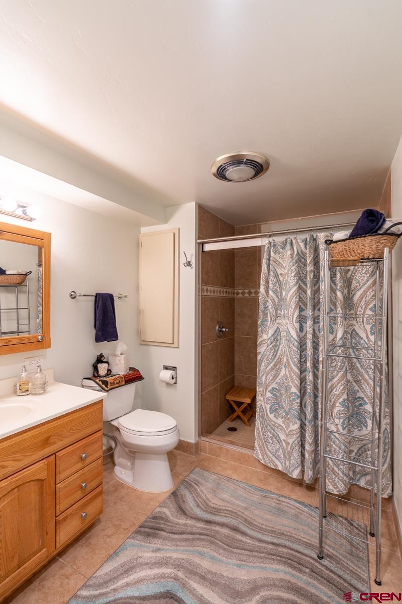 73 Tamarron Drive, Unit 866 Durango, CO 81301 - Photo 16 of 34 a bathroom with a sink toilet and shower