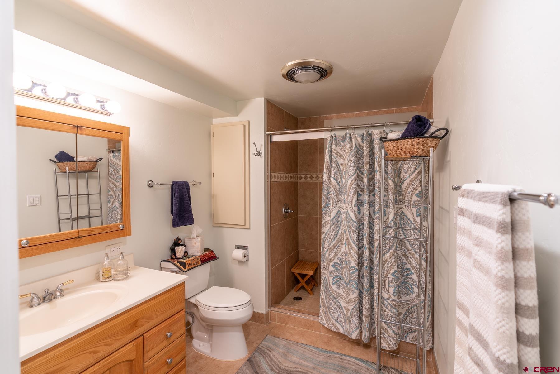 73 Tamarron Drive, Unit 866 Durango, CO 81301 - Photo 17 of 34 a bathroom with a sink toilet and shower