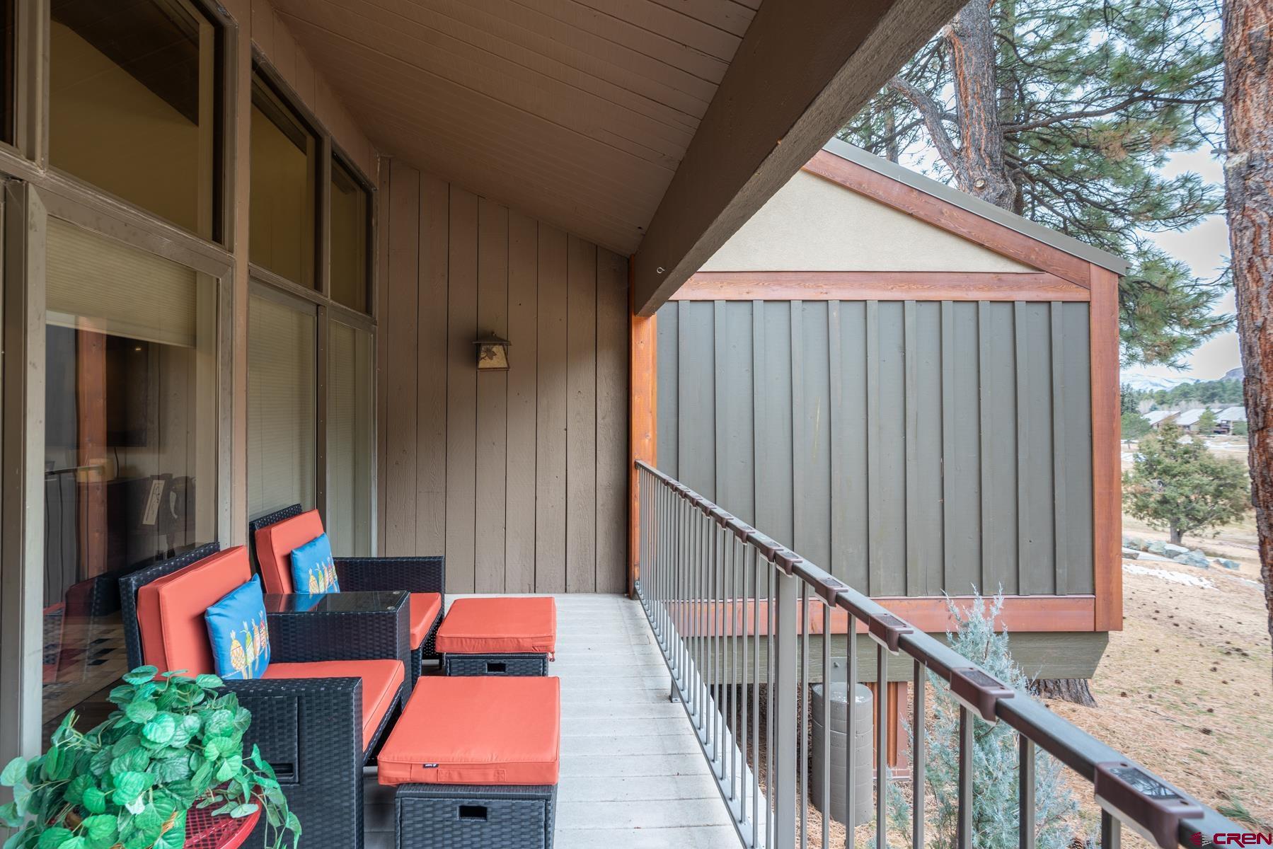 73 Tamarron Drive, Unit 866 Durango, CO 81301 - Photo 20 of 34 a balcony view with couches and a potted plant on a table