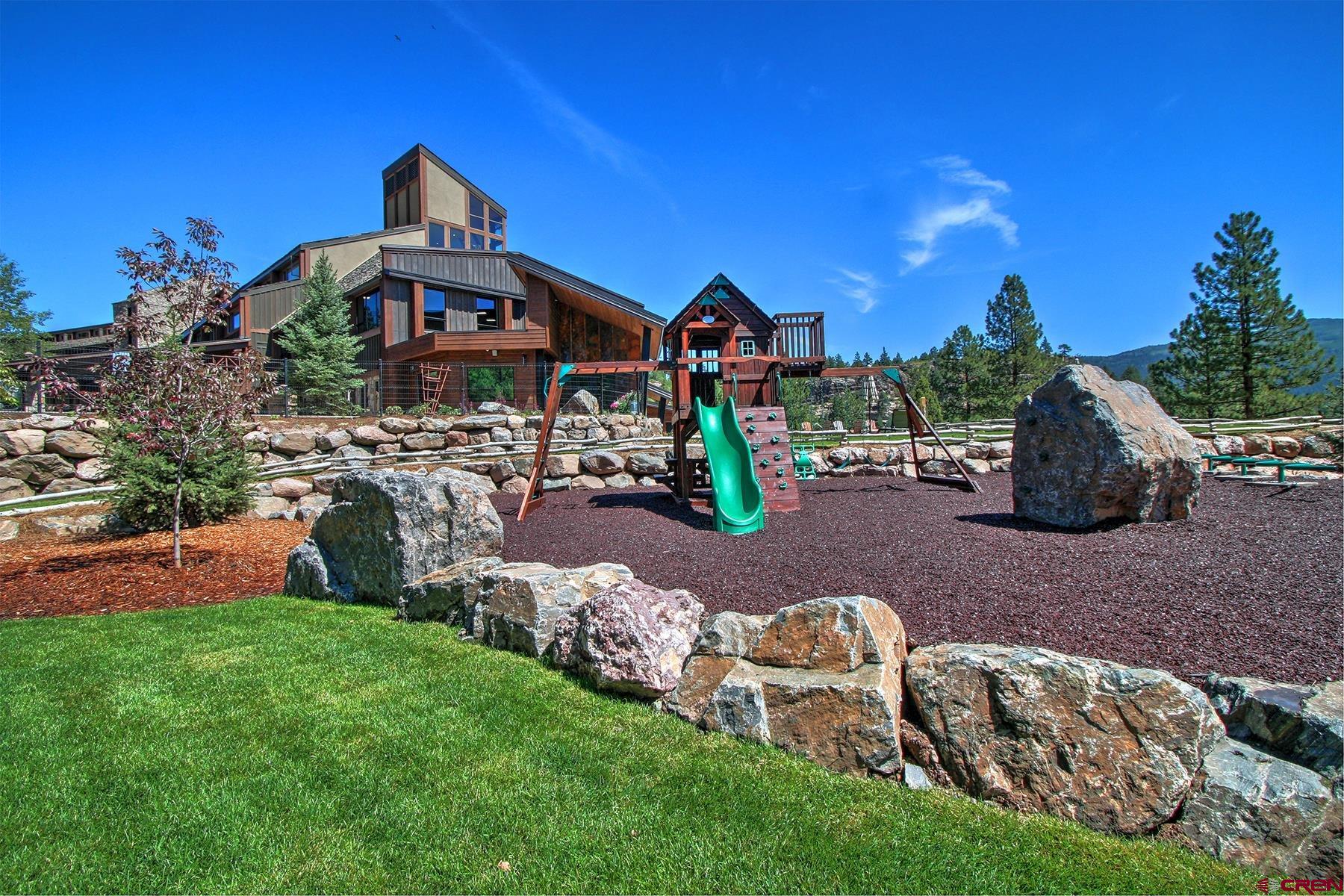 73 Tamarron Drive, Unit 866 Durango, CO 81301 - Photo 28 of 34 a front view of a house with garden