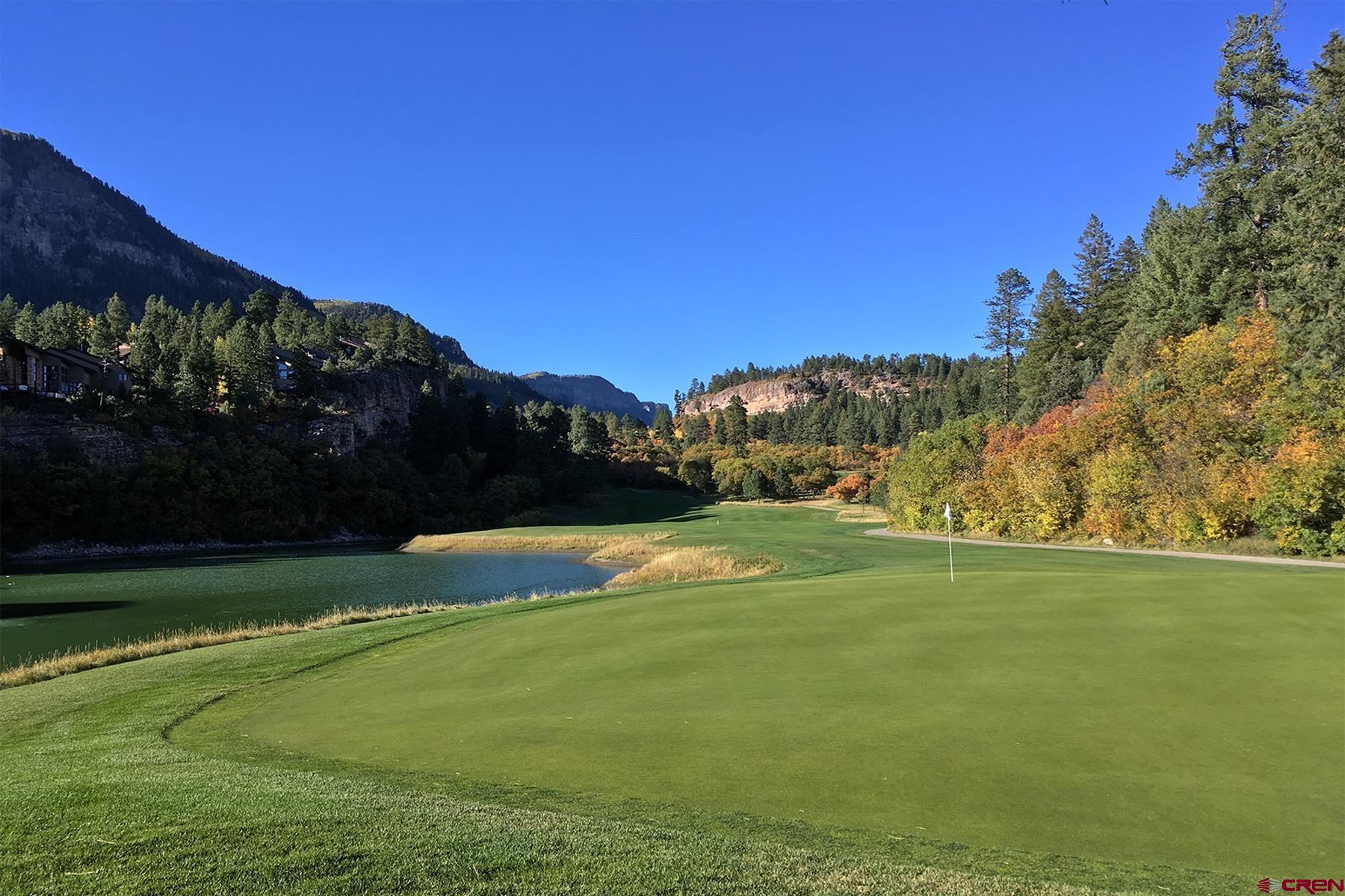 73 Tamarron Drive, Unit 866 Durango, CO 81301 - Photo 31 of 34 a view of a golf course with a lake