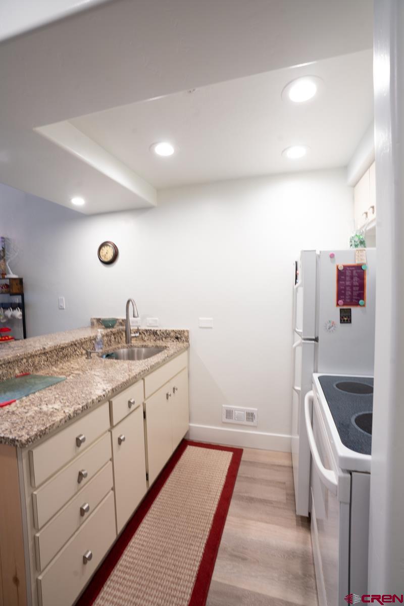 73 Tamarron Drive, Unit 866 Durango, CO 81301 - Photo 6 of 34 a bathroom with a sink and a mirror