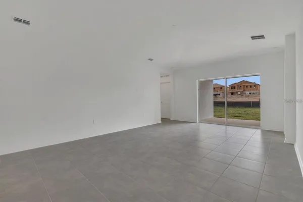 a kitchen with granite countertop a sink and cabinets