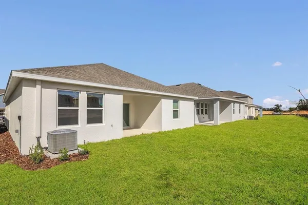 a front view of a house with a yard and porch