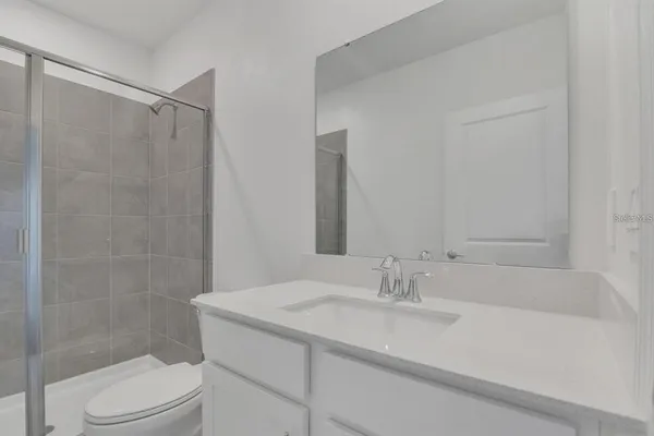 a bathroom with a sink a toilet and bathtub