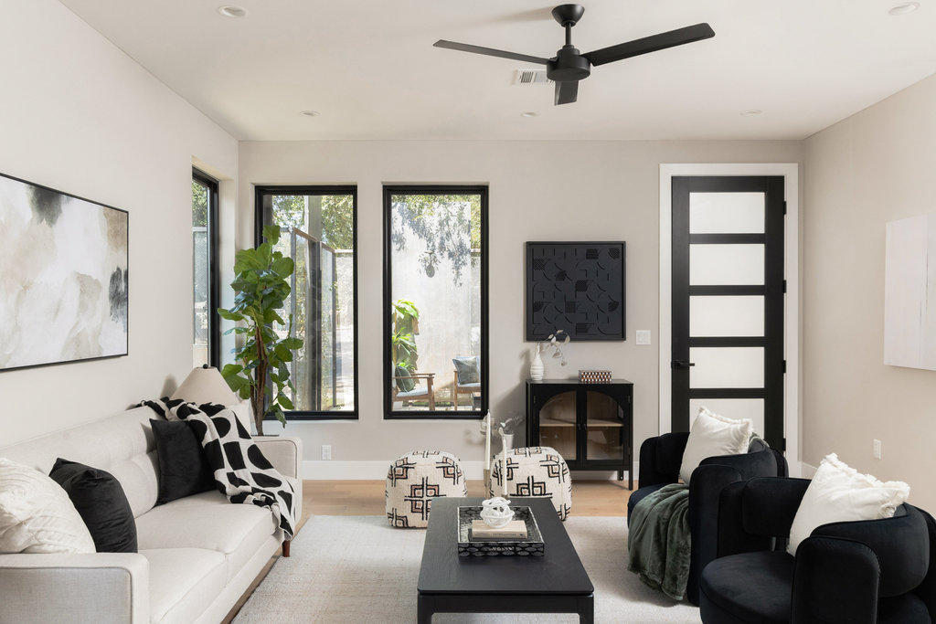 1401 East 3rd Street, Unit 1 Austin, TX 78702 - Photo 17 of 40 Living room featuring wood finished floors, ceiling fan, recessed lighting, and a fireplace