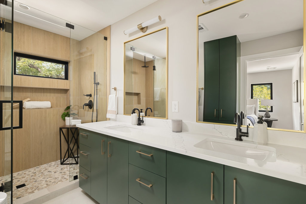 1401 East 3rd Street, Unit 1 Austin, TX 78702 - Photo 19 of 40 Bathroom with plenty of natural light, double vanity, and a shower stall