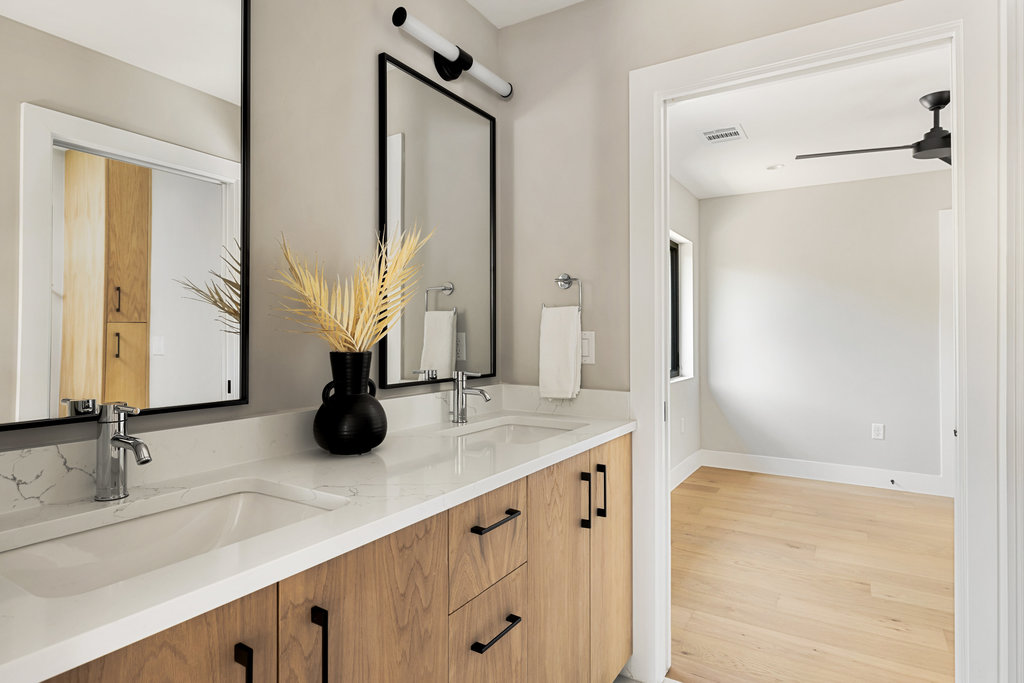 1401 East 3rd Street, Unit 1 Austin, TX 78702 - Photo 22 of 40 Bathroom with double vanity, light wood-type flooring, and ceiling fan