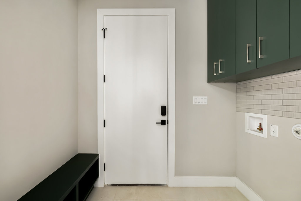1401 East 3rd Street, Unit 1 Austin, TX 78702 - Photo 29 of 40 Laundry area with washer hookup and cabinet space