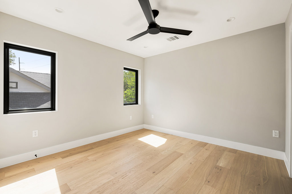 1401 East 3rd Street, Unit 1 Austin, TX 78702 - Photo 39 of 40 Spare room with light wood finished floors, ceiling fan, and recessed lighting