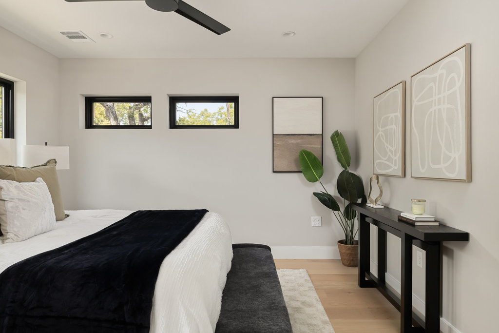 1401 East 3rd Street, Unit 1 Austin, TX 78702 - Photo 40 of 40 Bedroom featuring light wood finished floors, ceiling fan, and recessed lighting